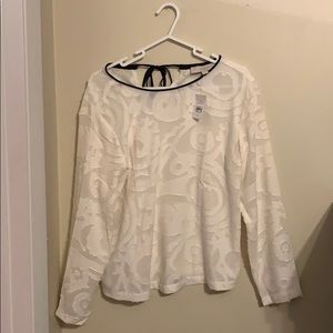 Never worn! White blouse with black trimming.